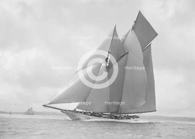 The beautiful schooner 'Cetonia' making good headway, 1911. Creator: Kirk & Sons of Cowes.