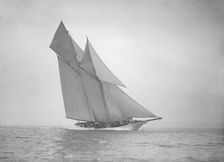 The beautiful schooner Cetonia making good headway, 1911. Creator: Kirk & Sons of Cowes