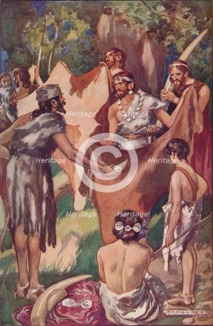 The beginnings of commerce: primitive people bartering ivory tusks and bull hides, 1907. Artist: Unknown.