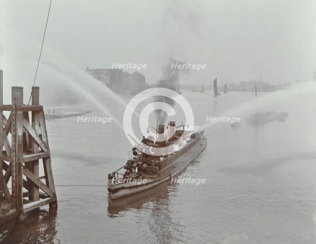 The 'Beta' fire float with hoses, River Thames, London, 1910. Artist: Unknown.