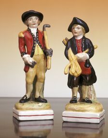 The Blackheath Golfer and his caddy Staffordshire figures, c1930. Creator: Unknown
