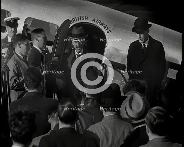 The British Prime Minister, Neville Chamberlain, Standing at the Door of a Lockheed Aero..., 1938. Creator: British Pathe Ltd.