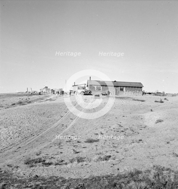 The Browning home, a partial dugout, Dead Ox Flat, Malheur County, Oregon, 1939. Creator: Dorothea Lange.