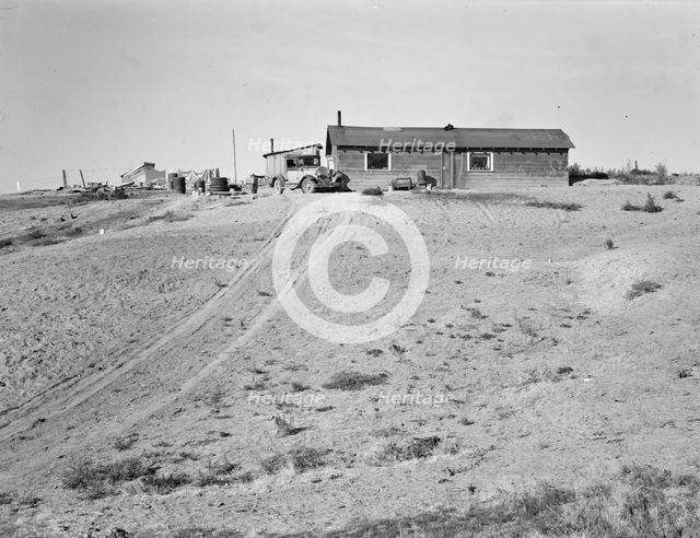 The Browning home, a partial dugout, Dead Ox Flat, Malheur County, Oregon, 1939. Creator: Dorothea Lange.