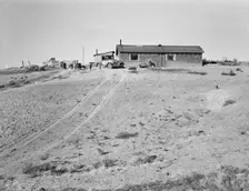 The Browning home, a partial dugout, Dead Ox Flat, Malheur County, Oregon, 1939. Creator: Dorothea Lange