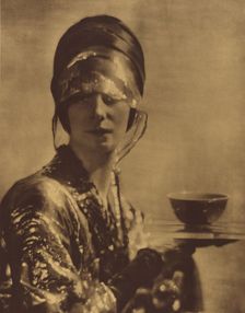 The Cup. Portrait of a woman holding a cup, c1910. Creator: Baron Adolf Edward Sigismond de Meyer