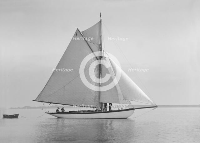 The cutter 'Wenda' in light winds, 1912. Creator: Kirk & Sons of Cowes.