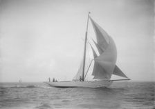 The cutter Westwind sailing with spinnaker, 1912. Creator: Kirk & Sons of Cowes