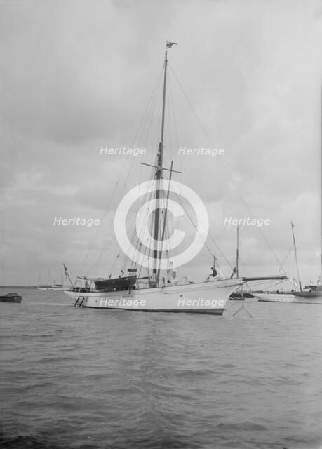 The cutter 'Yolande' at anchor, 1912. Creator: Kirk & Sons of Cowes.