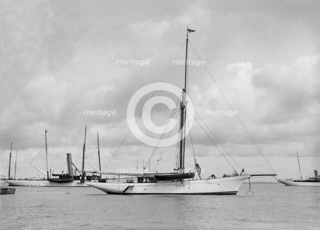 The cutter 'Yolande' at anchor, 1912. Creator: Kirk & Sons of Cowes.