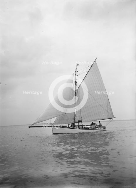 The cutter 'Blue Bird' under sail, 1934. Creator: Kirk & Sons of Cowes.
