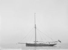 The cutter Cymberline under way by motor. Creator: Kirk & Sons of Cowes