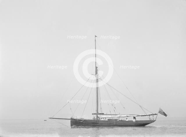 The cutter 'Cymberline' under way by motor. Creator: Kirk & Sons of Cowes.