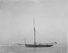 The cutter Cymberline under way by motor. Creator: Kirk & Sons of Cowes