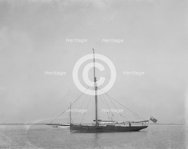 The cutter 'Cymberline' under way by motor. Creator: Kirk & Sons of Cowes.