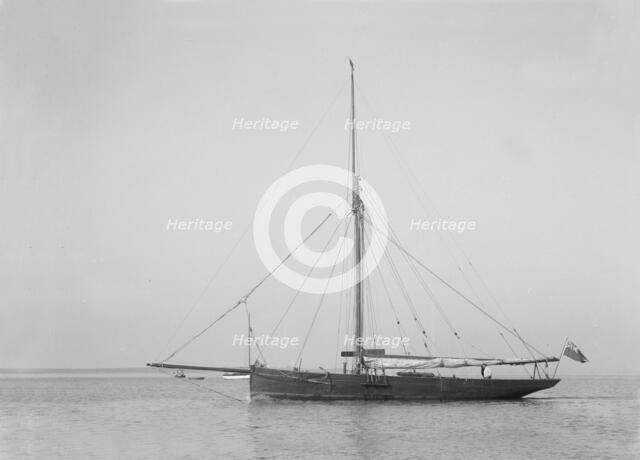 The cutter 'Cymberline' under way by motor. Creator: Kirk & Sons of Cowes.