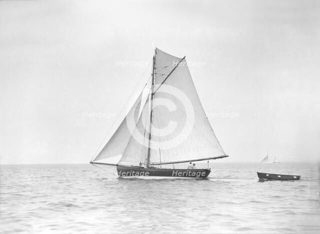 The cutter 'Jammie' under sail, 1911. Creator: Kirk & Sons of Cowes.