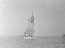 The cutter Mavourneen running downwind, 1922. Creator: Kirk & Sons of Cowes