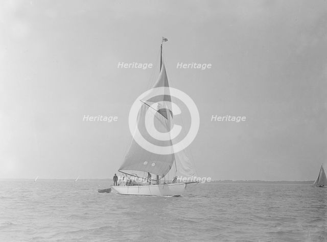 The cutter 'Mavourneen' running downwind, 1922. Creator: Kirk & Sons of Cowes.