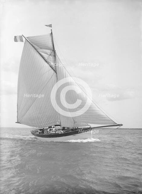 The cutter 'Nereid' sailing close-hauled, 1912. Creator: Kirk & Sons of Cowes.