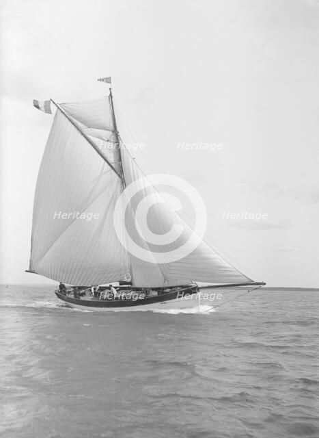 The cutter 'Nereid' sailing close-hauled, 1912. Creator: Kirk & Sons of Cowes.