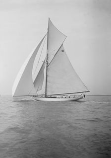 The cutter Onda sailing under spinnaker, 1911. Creator: Kirk & Sons of Cowes