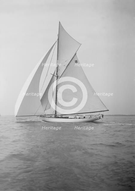 The cutter 'Onda' sailing under spinnaker, 1911. Creator: Kirk & Sons of Cowes.