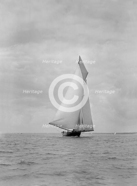 The cutter racing yacht 'Terpsichore' running downwind, 1922. Creator: Kirk & Sons of Cowes.