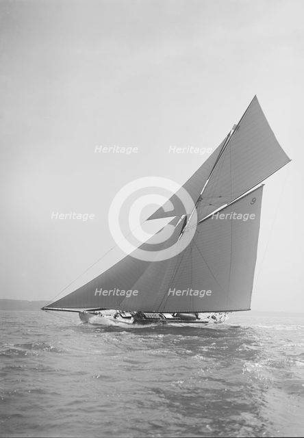 The cutter 'Rosamond' sailing close-hauled, 1911. Creator: Kirk & Sons of Cowes.