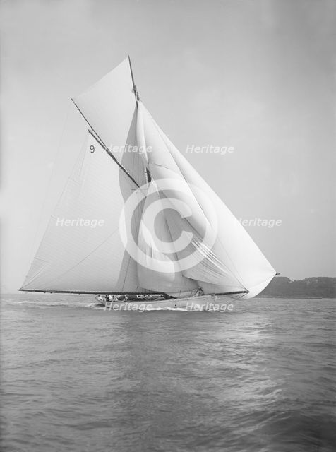 The cutter 'Rosamond' sailing with spinnaker, 1911. Creator: Kirk & Sons of Cowes.