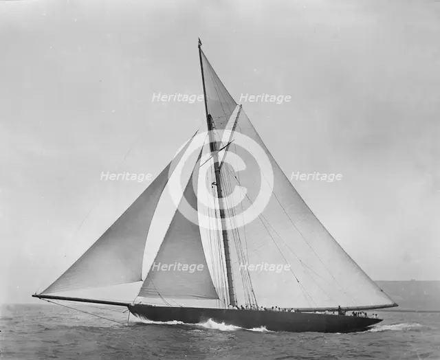 The cutter 'Shamrock' beating to windward. Creator: Kirk & Sons of Cowes.