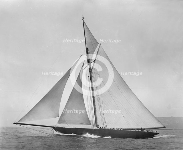 The cutter 'Shamrock' beating to windward. Creator: Kirk & Sons of Cowes.