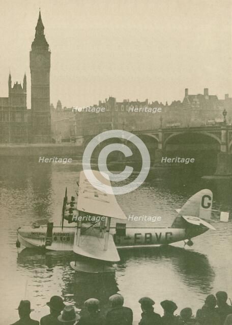 'The 'Calcutta' Flying-Boat Moored in the Thames opposite the Houses of Parliament', 1927. Artist: Unknown.