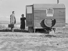 The camp nurse introduces doctor to mother of sick baby, Merrill, Klamath County, Oregon, 1939. Creator: Dorothea Lange
