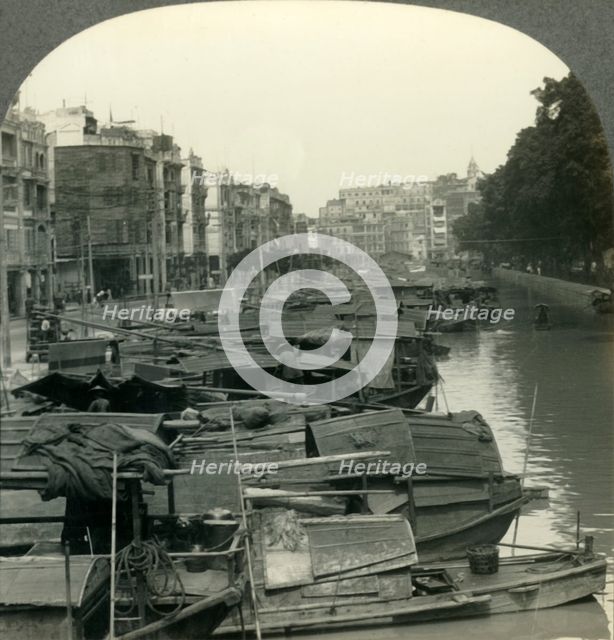'The Canal between Canton and the Island of Shameen, China', c1930s. Creator: Unknown.