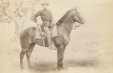 The Cavalier The young soldier and his horse on duty [a]t camp Cheyenne [] /, 1890. Creator: John C. H. Grabill
