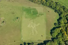 The Cerne Abbas Giant chalk hill figure and the Trendle enclosure earthwork, Dorset, 2015. Creator: Historic England