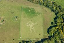 The Cerne Abbas Giant chalk hill figure and the Trendle enclosure earthwork, Dorset, 2015. Creator: Historic England