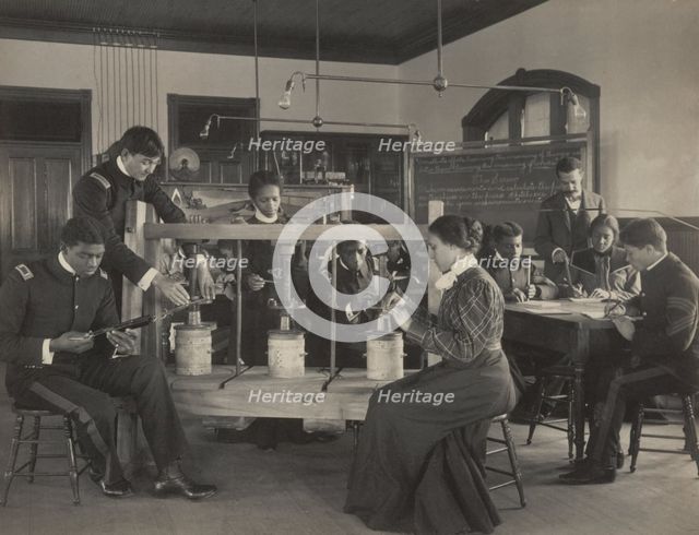 The cheese press screw - students studying agricultural sciences, Hampton Institute..., 1899 or 1900 Creator: Frances Benjamin Johnston.