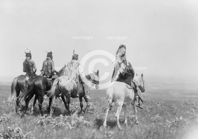 The chief and his staff, Apsaroke Indians, c1905. Creator: Edward Sheriff Curtis.
