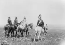 The chief and his staff, Apsaroke Indians, c1905. Creator: Edward Sheriff Curtis