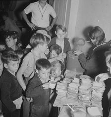 The children at Halloween party in Shafter migrant cooperative, California, 1938. Creator: Dorothea Lange