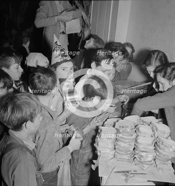 The children at Halloween party in Shafter migrant camp, California, 1938. Creator: Dorothea Lange.