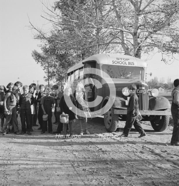 The children from Dead Ox Flat get off bus at school yard, Ontario, Oregon, 1939. Creator: Dorothea Lange.