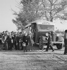 The children from Dead Ox Flat get off bus at school yard, Ontario, Oregon, 1939. Creator: Dorothea Lange
