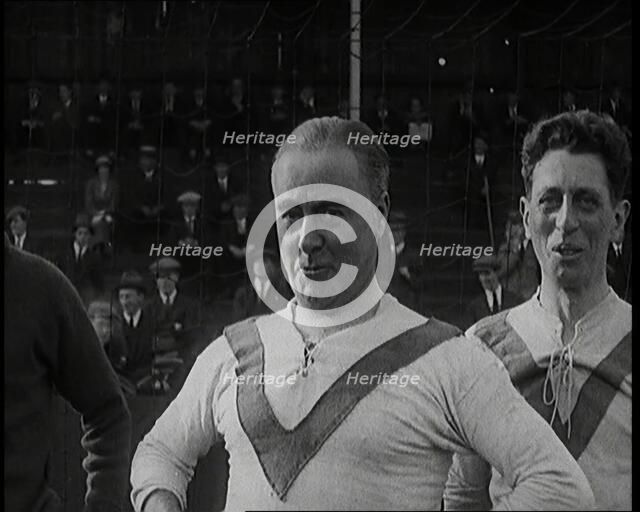 The Comedian George Robey Pulling Faces On a Football Pitch in Front of a Large Crowd, 1920s. Creator: British Pathe Ltd.