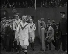 The Comedian George Robey Running Out Onto a Football Pitch in Front of a Large Crowd, 1920s. Creator: British Pathe Ltd