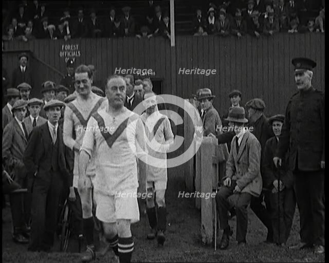 The Comedian George Robey Running Out Onto a Football Pitch in Front of a Large Crowd, 1920s. Creator: British Pathe Ltd.