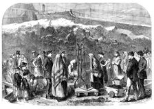 The Cotton Famine: distributing coal at the Castle-field old coal-wharf, Manchester, 1862. Creator: Unknown