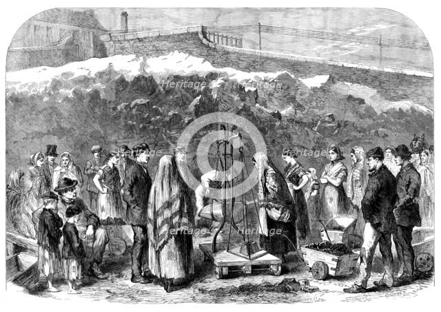 The Cotton Famine: distributing coal at the Castle-field old coal-wharf, Manchester, 1862. Creator: Unknown.